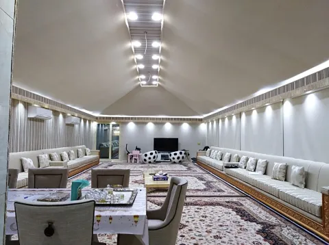 Arabic tent interior decoration UAE — chandeliers, draping and kilim rugs